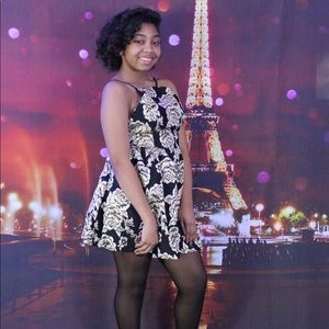 Black halter dress with gold floral detail